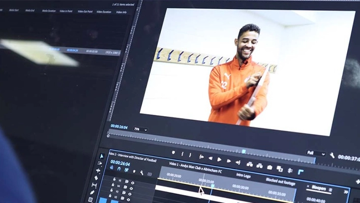 Screenshot of a video editor manipulating a promotional video in Adobe Premiere. Screenshot of a video editor manipulating a promotional video in Adobe Premiere.